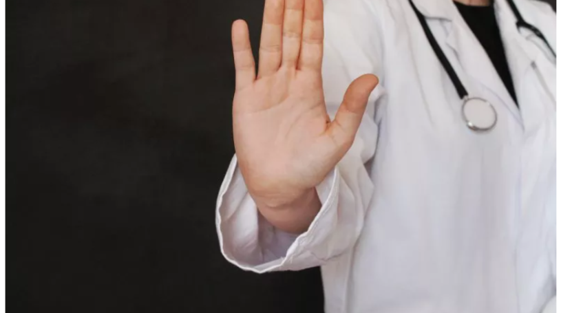 A stock image of a doctor refusing a patient. A new bill in Iowa would protect medical practitioners who decline treatments based on religious or moral beliefs. MARTA ORTIZ/GETTY IMAGES